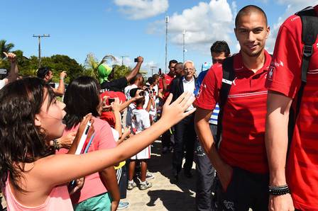 Switzerland's midfielder Gokhan Inler arrives with teammates on June 7, 2014 La Torre Hotel in Porto Seguro, a few days prior to the start of the 2014 FIFA World Cup in Brazil. AFP PHOTO / ANNE-CHRISTINE POUJOULAT
