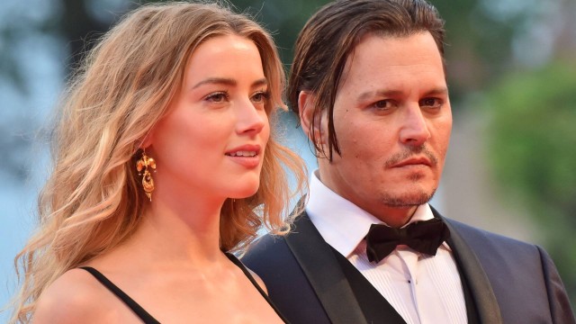 O ator americano Johnny Depp e Amber Heard na exibição do filme "Aliança do crime"